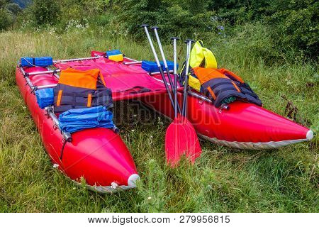 Water Trip On A Catamaran On A Dniester River. Red Catamarans Close-up.