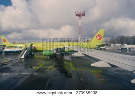 Moscow, Russia Feb. 26, 2016: S7 Siberian Airlines Airliners With Ladders In Domodedovo Airport. Vie