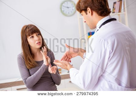 Deaf-mute female patient visiting young male doctor 