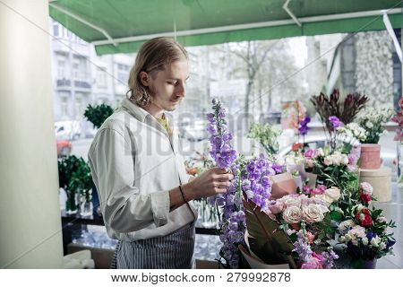 Serious Florist Choosing Unordinary Flowers For Ikebana