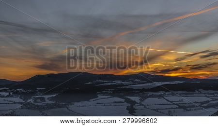 Sunrise On Boren Hill Near Bilina Town In Winter Frosty Color Morning