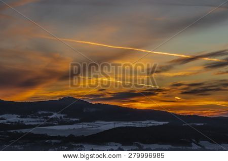 Sunrise On Boren Hill Near Bilina Town In Winter Frosty Color Morning