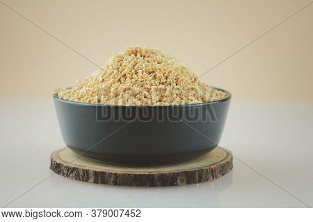 Ground Peanut Powder In Black Bowl Ready To Cook