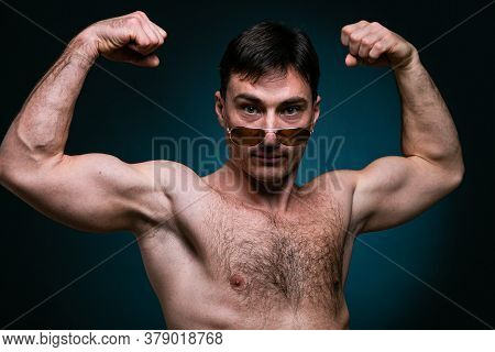 Gay Man Athlete Strong In Sunglasses Portrait