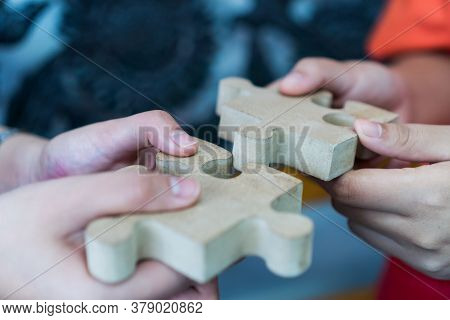 Businesswoman Hand Of Teamwork Holding Jigsaw Puzzle Connecting, Business Team Work Of Solutions In 