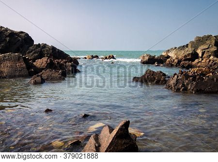 Picture Of A Rocky Beach With A View Of The Horizon In Arambol Beach, Goa, India