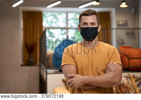 Social Distancing At Work. Portrait Of Young Confident Man, Male Office Worker In Protective Face Ma