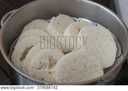 Czech Yeast Dumpling Sliced Into Wheels And Put Into A Steaming Pot To Keep The Dumpling Hot