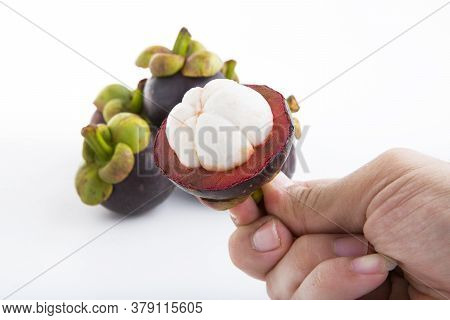 A Delicious Ripe Mangosteen On A White Background