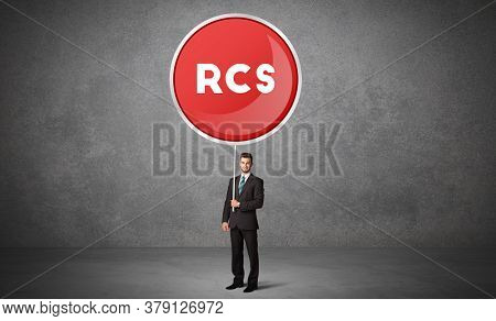 Young business person holdig traffic sign with RCS abbreviation, technology solution concept
