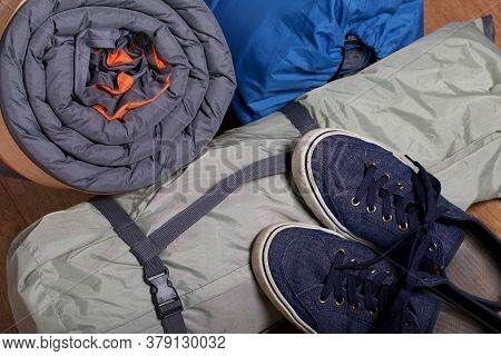Tourist Equipment. Self-inflating Rugs And Sneakers. Close-up Shot.