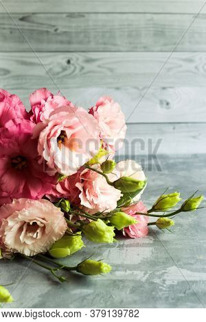 Bright Bouquet With Eustoma. Bouquet On Soft Gray Background. High Quality Photo