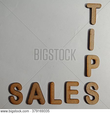 Sales Tips Word Presented On White Surface With Wooden Cross Text Cloud Frame Art Business Learning 