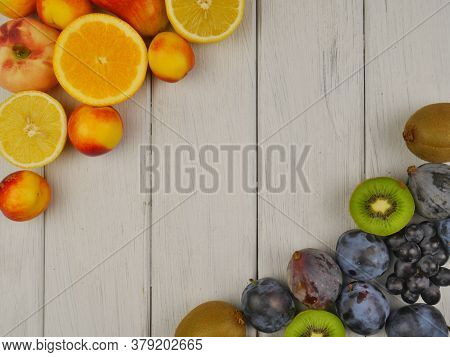Different Ripe Beautiful Fruits On White Boards. Close-up. Space For Text. Proper Nutrition.
