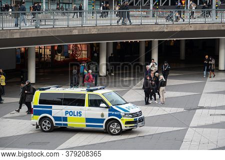 Stockholm, Sweden - March 7, 2020: Swedish Police Car Parked In The Middle Of Pedestriants Only Stre