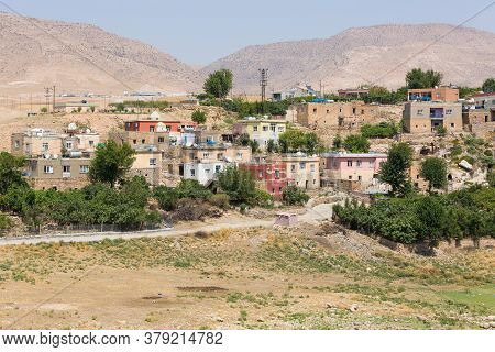 The View Of Hasankeyf Town And Surrounding Mountains, Turkey, Eastern Anatolia. Houses With Water He