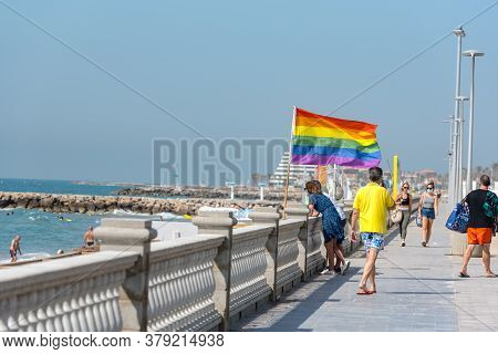 Sitges, Catalonia, Spain: July 28, 2020: People On The Paseo Maritimo In The City Of Sitges In The S