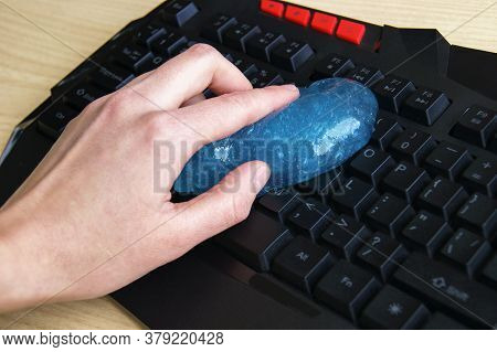 Blue Soft Gel Cleaning Dust On Keyboard. Concept Cleaning Your Computers Keyboard.