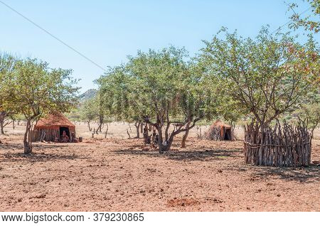 Epupa, Namibia - May 27, 2011: A Himba Village Near Epupa. Traditional Huts And People Are Visible