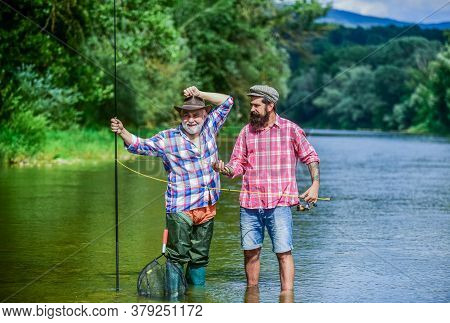Master Baiter. Fisherman With Fishing Rod. Activity And Hobby. Fishing Freshwater Lake Pond River. B