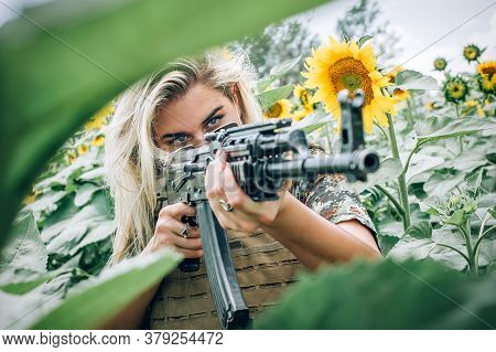 Beautiful And Attractive Woman Soldier With Rifle Machine Gun