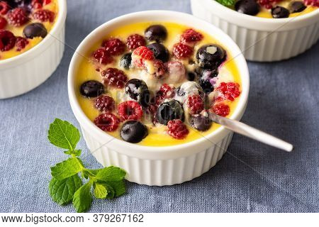 Delicious Clafoutis Made From White Yogurt And Berries, Raspberries And Blueberries, Clafoutis In Po