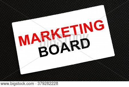 White Card On The Black Background With Text Marketing Board