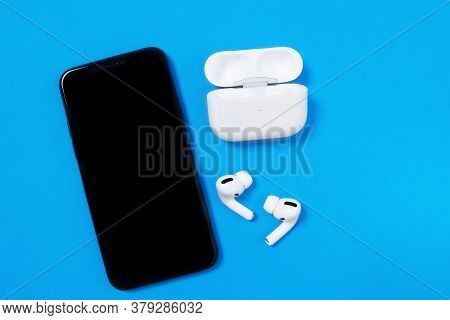 Rostov, Russia - July 06, 2020: Smartphone Apple Iphone 11 Pro And Wireless Headphones With Opened C