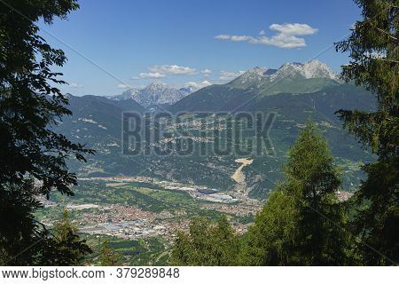 View Of Breno, Brescia, Lombardy, Italy, From The Road To Crocedomini Pass At Summer. Mountain Lands