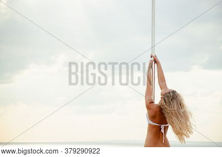 Hand Of Woman Reaching For Metal Pipe Leading To A Blue Sky. Development Motivation Career Growth Co