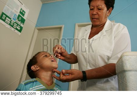 Eunapolis, Bahia / Brazil - August 14, 2010: Child Seen Receiving Dose Of Polio Vaccine At Health Po