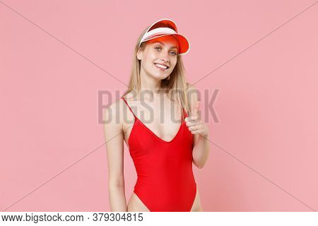 Smiling Young Blonde Woman Girl In Red One-piece Swimsuit Cap Posing Isolated On Pink Background Stu