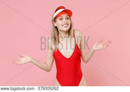 Smiling Young Blonde Woman Girl In Red One-piece Swimsuit Cap Posing Isolated On Pink Background Stu
