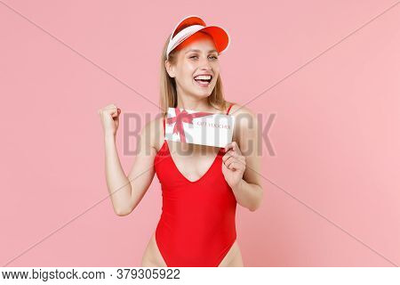 Joyful Young Blonde Woman Girl In Red One-piece Swimsuit Cap Isolated On Pink Background. People Sum