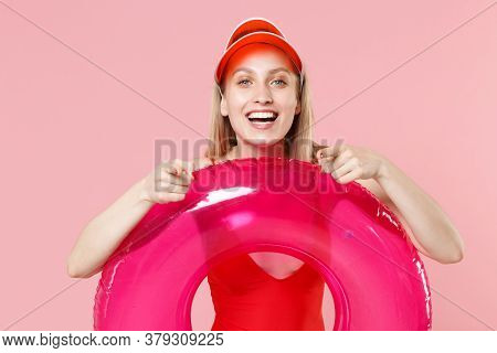 Cheerful Young Blonde Woman Girl In Red One-piece Swimsuit Cap Isolated On Pink Background. People S