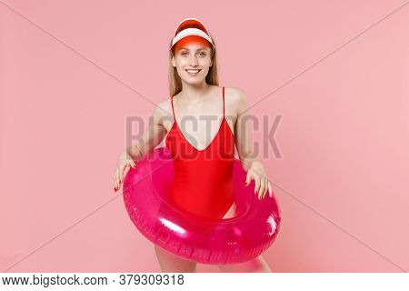 Smiling Young Blonde Woman Girl In Red One-piece Swimsuit Cap Posing Isolated On Pink Wall Backgroun