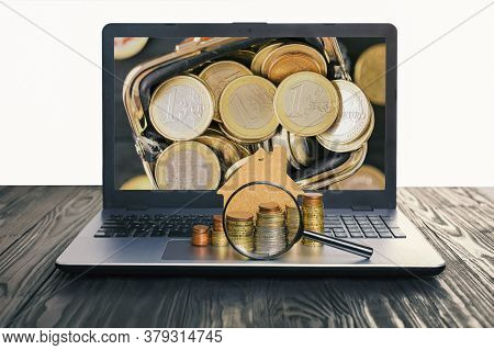 Concept Of The Sale And Rental Of Housing, Mortgage, Loan. Lap Top With Blank Screen And Heap Of Eur