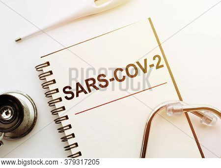 Top View Of Sars-cov-2 Lettering Surrounded By Medical Stuff With Sars Cov 2 Fight Concept