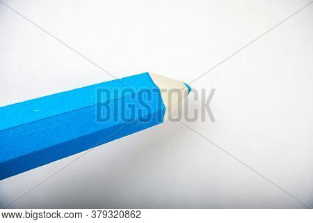 Blue Pencil Stands On A White Background
