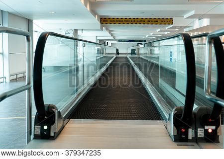 A Travelator In An Empty Airport Corridor During The Coronavirus Pandemic.