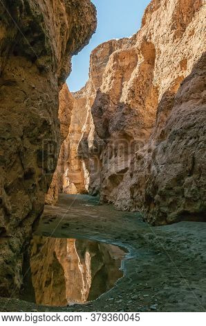 Inside Of The Sesriem Canyon In The Tsauchab River. Water Is Visible