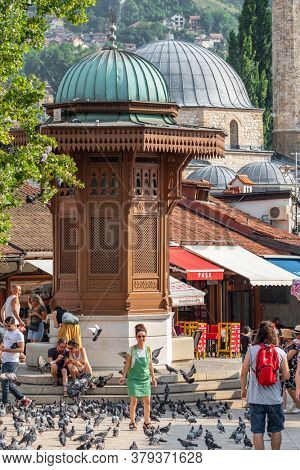 Sarajevo, BiH - August 28, 2019: Bascarsija square with Sebilj wooden fountain in Old Town Sarajevo in Bosnia and Herzegovina