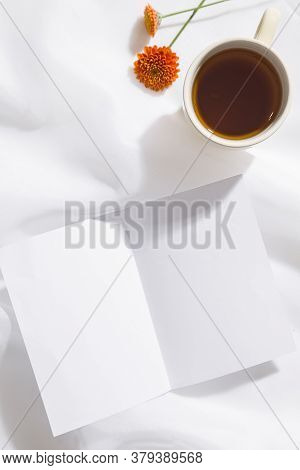 Top View Of Voile Fabric Background With Flowers In Two Corners With Space For Text