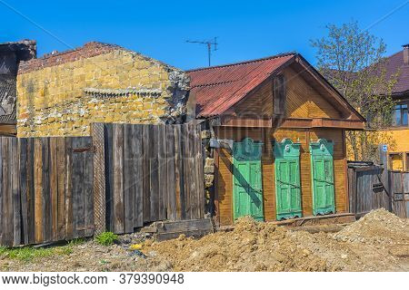 Wooden Architecture Of Siberia. Wooden Houses On Streets In The Center Of Irkutsk