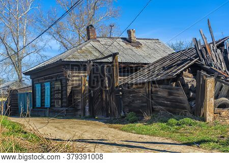 Wooden Architecture Of Siberia. Wooden Houses On Streets In The Center Of Irkutsk