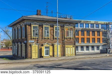 Wooden Architecture Of Siberia. Wooden Houses On Streets In The Center Of Irkutsk