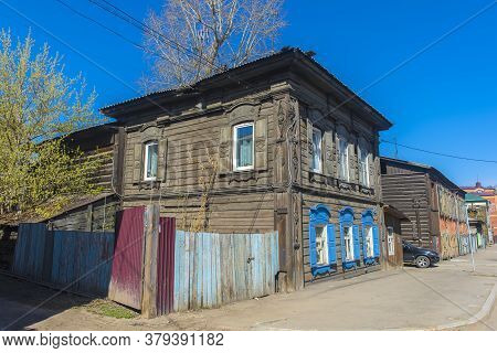Russia, Irkutsk 06,05,2018 Wooden Architecture Of Siberia. Wooden Houses On Streets In The Center Of