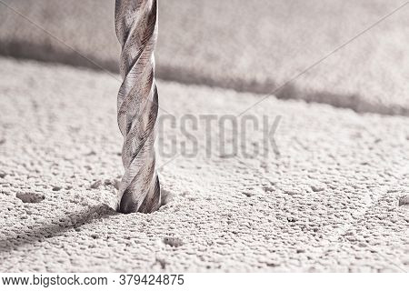 Metal Drill Bit Make Holes In Concrete Wall On Industrial Drilling Machine With Shavings. Metal Work