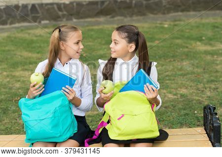 Beginning Their Knowledge Journey. Happy Girls Back To School On September 1. Little Children On Sep