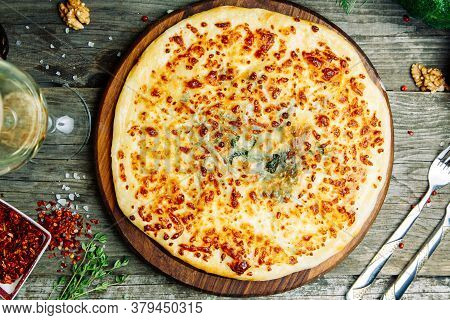 Khachapuri In Megrelian On The Board. Azerbaijani Restaurant Dish With Vegetable Decor On A Wooden B
